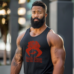 Man wearing a black tank top with a red graphic and text, standing outdoors.